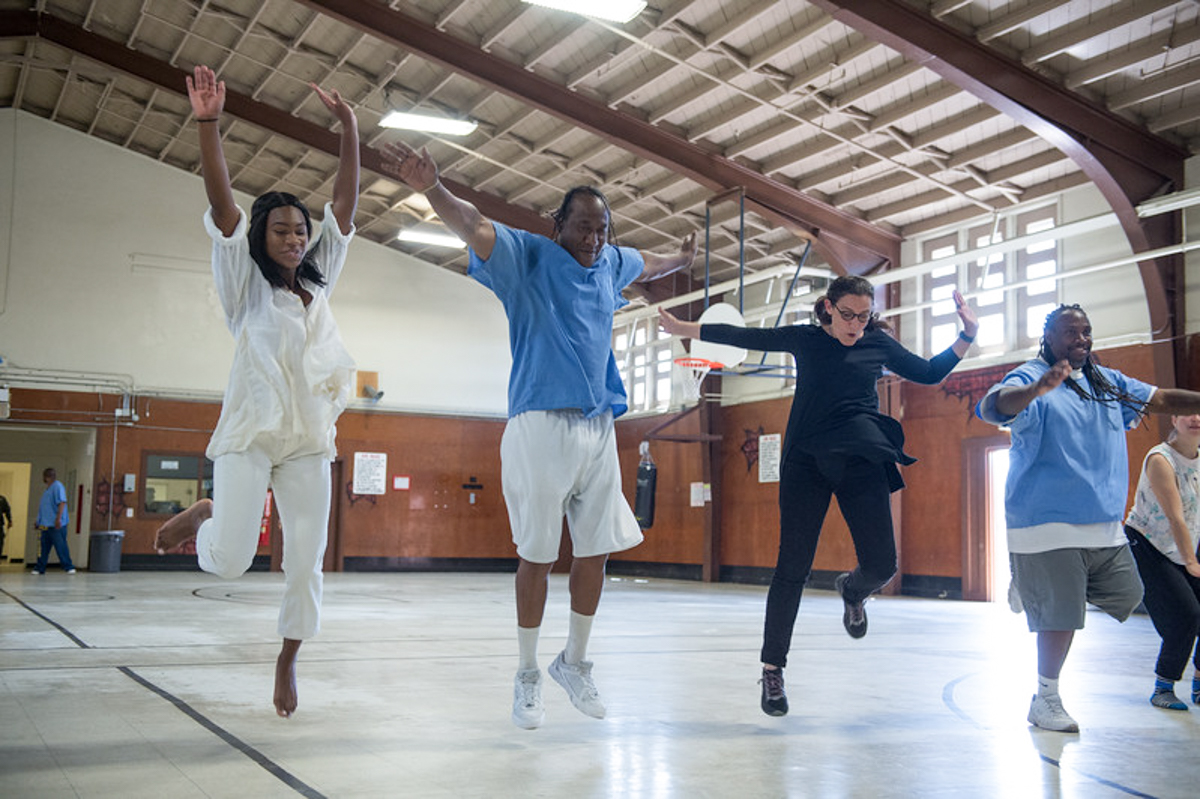 Suchi Branfman dances with incarcerated men at the California Rehabilitation Center in Norco, CA. Photo by Cooper Bates.